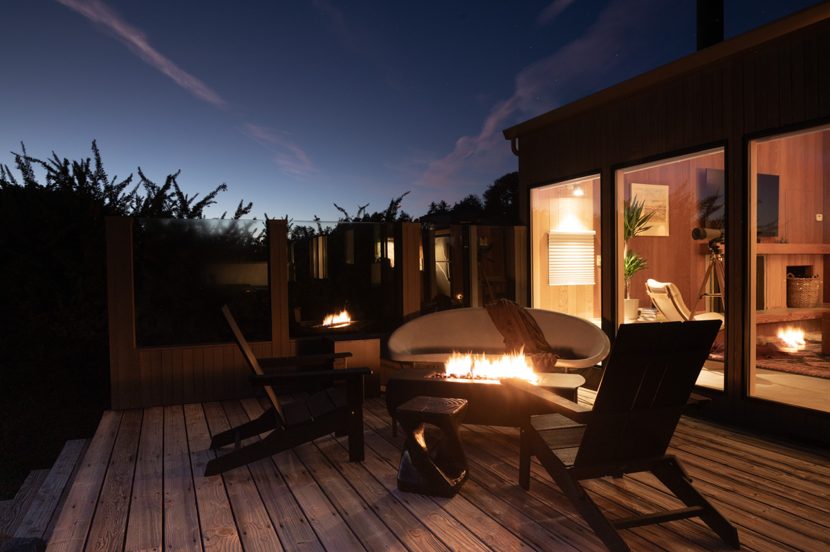 Sea Ranch California Beach House back deck with Pollywood Adirondack Chairs at night